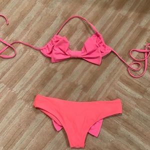 Lolli Swim coral and pink bow bikini top